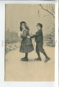 431946 Children go ice skating in winter Vintage photo postcard