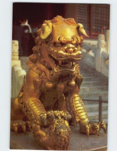 Postcard A gilded bronze lion in front of the Gate of Heavenly Purity, China