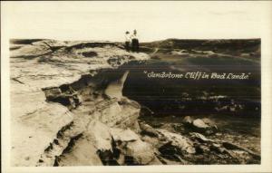 People Standing on Sandstone Cliff Badlands Bad Lands SD Real Photo Postcard