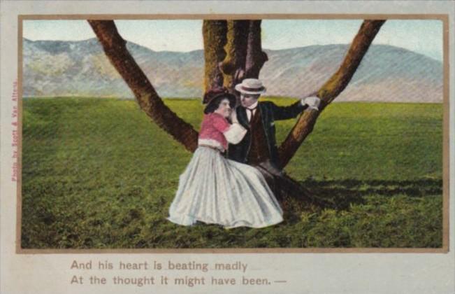 Romantic Couple Sitting In Tree And His Heart Is Beating Madly