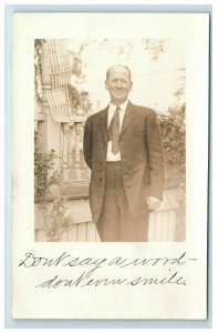 RPPC Man in Suit US Flags on Porch Behind Him Real Photo Postcard Patriotic