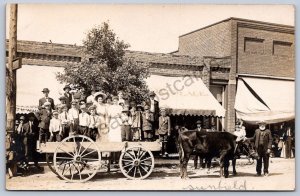 K51/ Sunfield Michigan RPPC Postcard c1910 Cattle-Drawn Wagon Full People 174