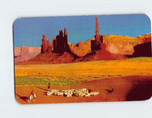 Postcard Navajo children rest their sheep on sand dunes, Monument Valley, AZ