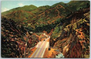 VINTAGE POSTCARD CARS DRIVING THROUGH UTE PASS AT MANITOU SPRINGS COLORADO