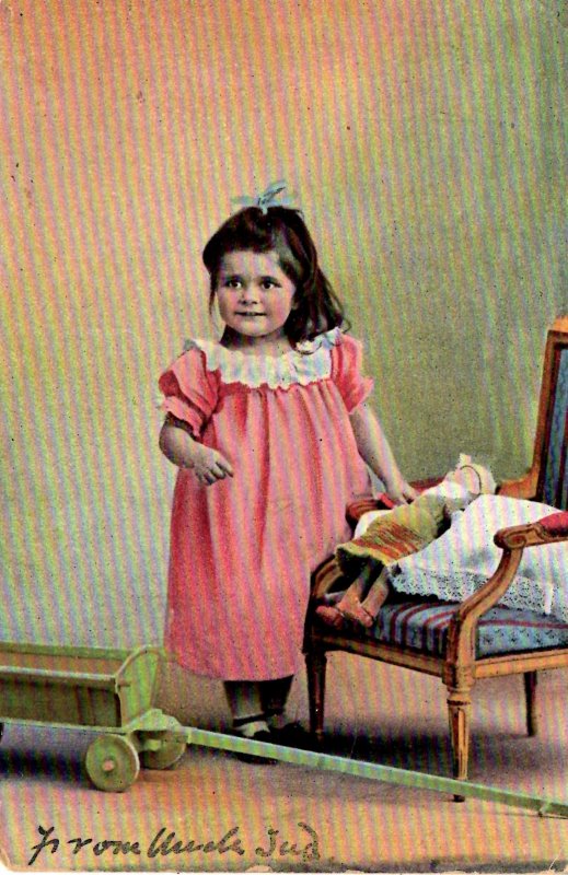 Little Girl with her doll and Wagon - in 1906