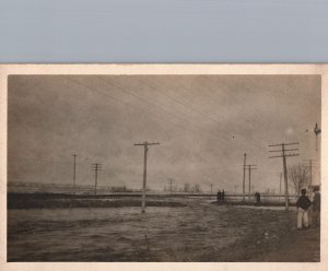 VINTAGE POSTCARD MEN GAZE MID-WEST FLOODS COVERING UNION PACIFIC RAILROAD TRACKS