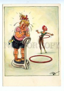 498837 Germany GDR gymnastics with Hula Hoop humor weighing after training Weg