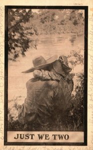 1910 Just We Two Couple Kissing while Seated in front of Lake Romance Postcard