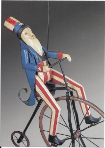 US Patriotic mint card. showing Uncle Sam pedaling a high-wheel bicycle.  Nice.