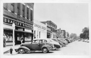 J55/ Sidney Iowa RPPC Postcard c1940s Main Street Bradley Store Grocery 258