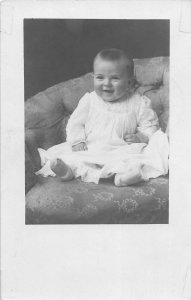 G55/ Hebron Illinois RPPC Postcard 1910 Smiling Baby on Coush Sofa