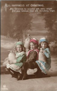 Christmas Happiness Children on Sled With Sacks Hand Colored RPPC Postcard W10
