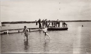 Harris Saskatchewan Water Scene Dock Boat People SK Sask Regal RPPC Postcard H49