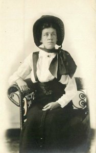 Bonnet C-1910 Stern Woman RPPC Photo Postcard Wicker Furniture 21-120