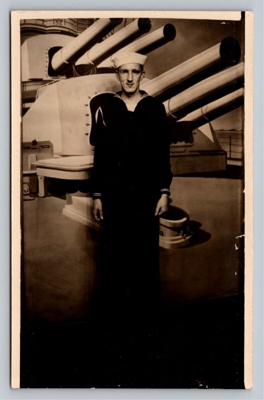 RPPC U.S. Navy Sailor in Front of Gun Turret in Studio Props WWII Real Photo UNP 