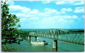 A stern-wheeler steamboat under the Mark Twain Memorial Bridge - Hannibal, MO