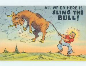 Linen comic SLING THE BULL - MAN SWINGS BULL BY THE TAIL HL3480