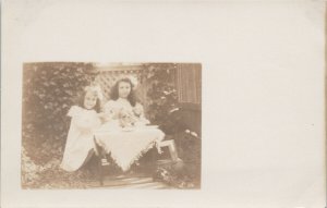 Portrait of Two Young Girls w/ Doll Children Unknown Location RPPC Postcard F25