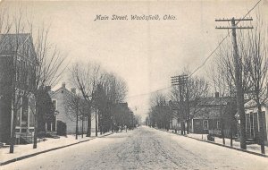 Main Street Woodsfield Ohio 1910c postcard