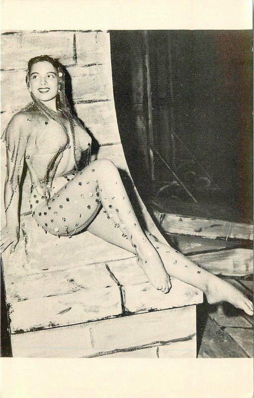 Bikini Beauty Fish Nets posing by fireplace interior 1940s Postcard Moss 962