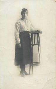 Women portraits near tall table early photo postcards x 2