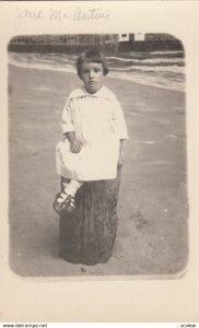 RP: VENICE , California , 00-10s Girl on stump in front of pier