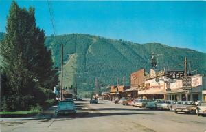 JACKSON, WY Wyoming  STREET SCENE Cowboy Bar, c1950s & 60s Cars Postcard