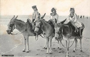 Lot 53 un trio italy children riding donkey on beach types folklore costume