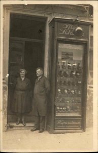 German Shoe Repair & Sales Glass Case on Sidewalk Real Photo Postcard c1910