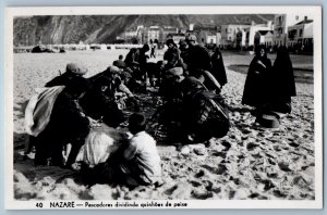 Nazare Portugal Postcard Fishermen dividing shares of fish c1930's RPPC Photo