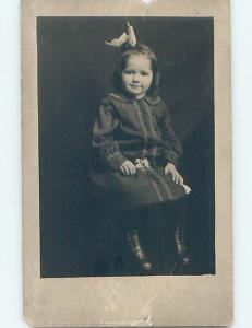 Pre-1918 rppc CUTE GIRL WEARING BUTTON SHOES WITH BOW IN HER HAIR HM0241