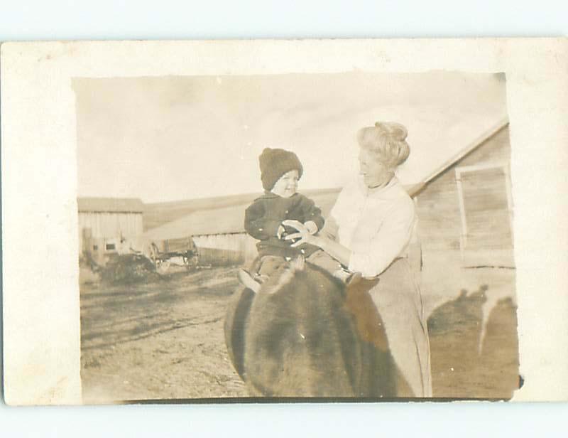 1910 rppc GRANDMA WATCHES LITTLE BOY ON HORSE BY THE BARN o2184