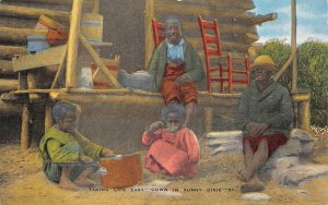 TAKING LIFE EASY DOWN IN SUNNIE DIXIE CHILDREN BLACK AMERICANA POSTCARD c. 1930