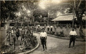 PC CPA natives in a garden real photo postcard INDONESIA (a15038)