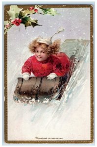 c1905 Christmas Girl Sledding Winter Snow Holly Berries Embossed Postcard