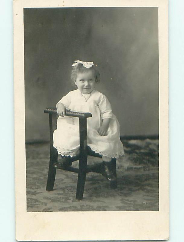 Pre-1920's rppc CUTE GIRL WITH BOW IN HAIR POSING FOR CAMERA r6269