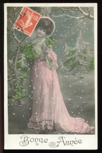 Bonne Annee. Vintage French real photo postcard. Woman in snow, long pink dress