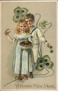 New Year - Boy & Girl Clovers Horseshoe c1910 Embossed Postcard