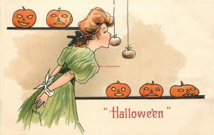 Halloween, Women With Hands Tied, Catching apples with Mouth, Jack O Lanterns