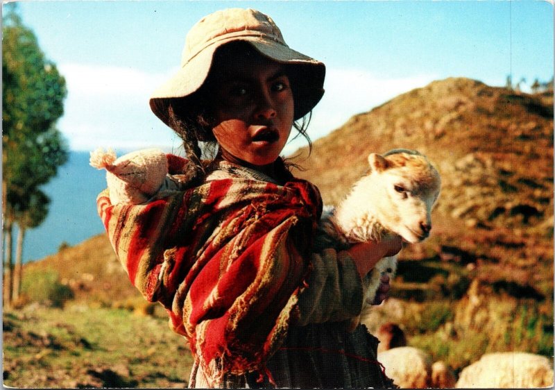 VINTAGE CONTINENTAL SIZE POSTCARD YOUNG SHERPHERDESS OF LLAMA AT PUNO PERU