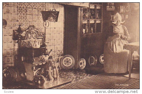 VOLENDAM, Dutch woman in the kitchen, North Holland, Netherlands, PU-1910