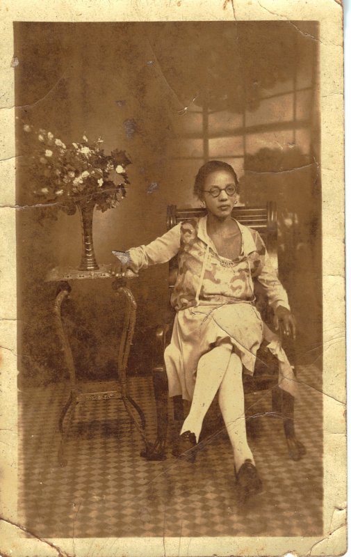 Rare Turn of the Century RPPC of an African American woman seated.