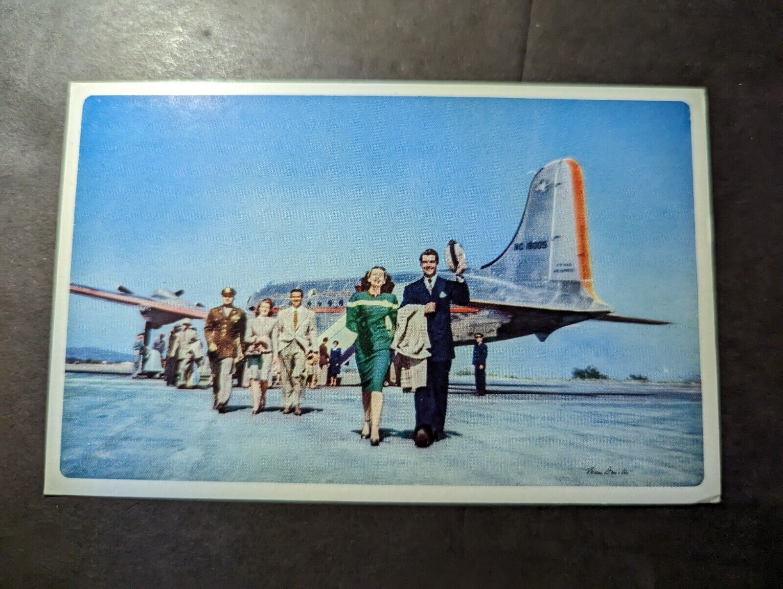1960s AMERICAN AIRLINES A-707 JET ASCENDING THROUGH CLOUDS Stock Photo