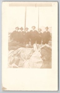 RPPC Young Men In Suits Standing Over Sleeping Soldiers Real Photo Postcard B41