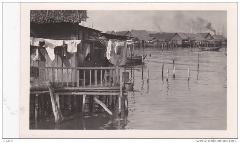 RP, INDIA, 1920-1940s; Partial Scene, Homes, Clothes Drying Outside