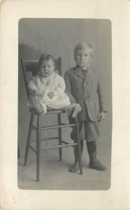 RPPC Postcard; Sweet Boy & Baby Sister in High Stool, Children & Infants Unk. US