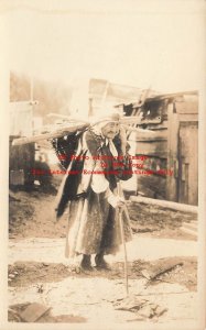 Native American Indian, RPPC, Woman Using a Walking Stick Gathering Wood, Alaska