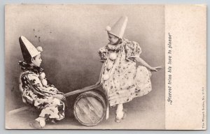 Pierrot tries his love to Please Children Playing on Barrel Seesaw Postcard H27