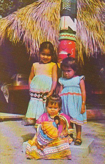 Seminole Children In Colorful Dress At Tropical Gardens Miami Florida