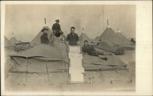 US Army Soldiers & Tents Results of a Sand Storm c1910 Real Photo Postcard